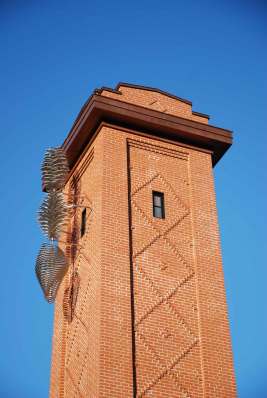 A sculpture by Quebec artist Paolo Fournier adorns the former firehouse building's tall tower once used to dry hoses.