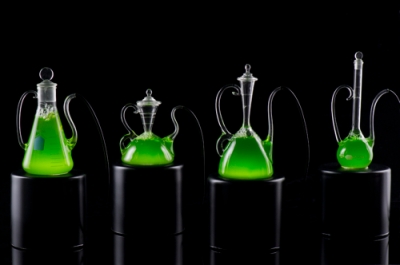 Tom Zogas (Rochester Institute of Technology), Personal Microalgae Production Units, 2012. H 14, W 6, D 5 in. (largest). Blown glass, water, microalgae, flourescent light.