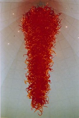 Dale Chihuly's 1995 work Gonzaga Red Chandelier at the Jundt Museum in Spokane, Washington, inspired a local resident to quickly amass a Chihuly collection to donate to the museum, but he fell prey to a admitted counterfeiter instead.